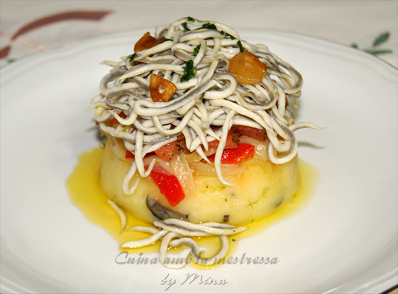 Timbal de patatas trufadas con angulas sucedáneas